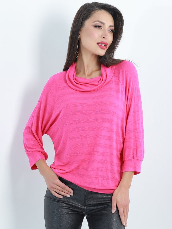 Bat blouse in bright pink.